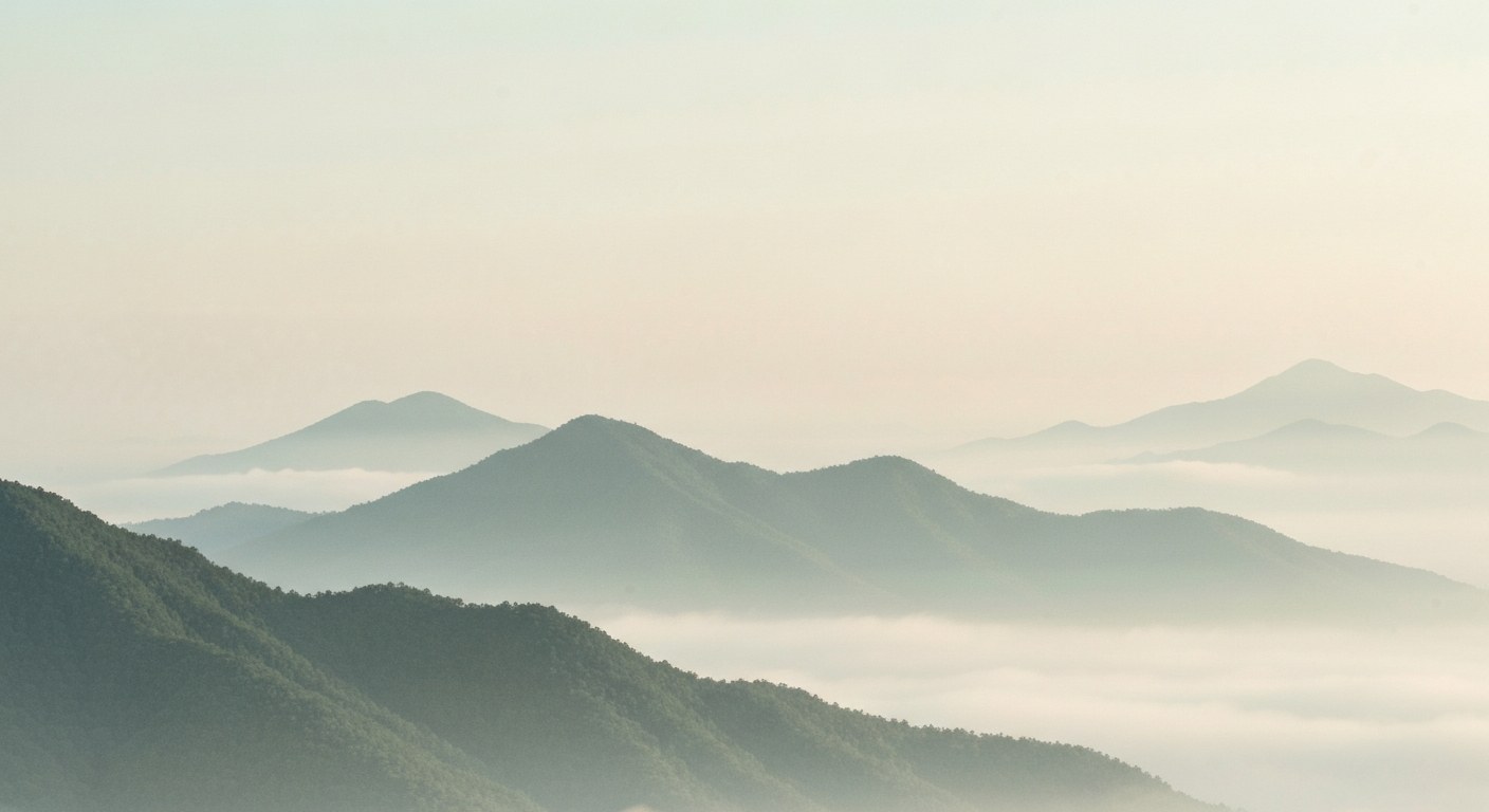 Soft watercolour of a misty mountain landscape at dawn with peaks in cloud on aged parchment
